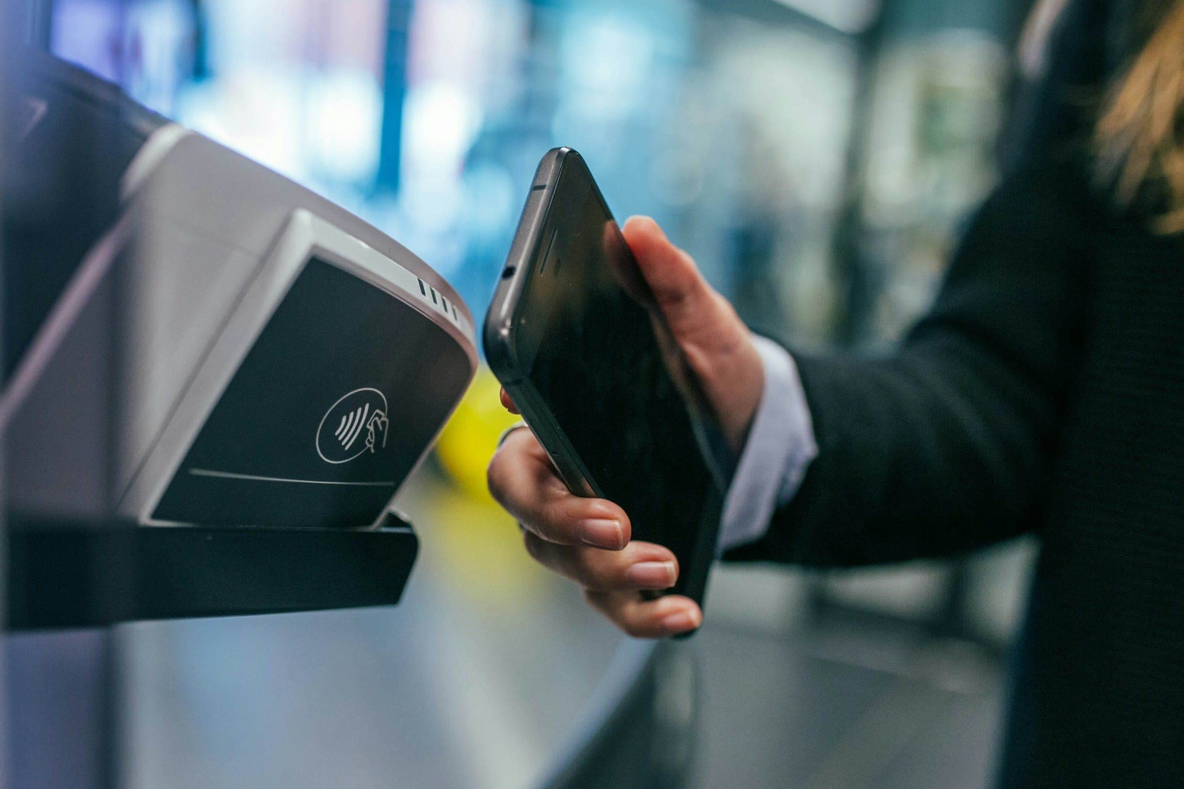 A phone held against a contactless card terminal